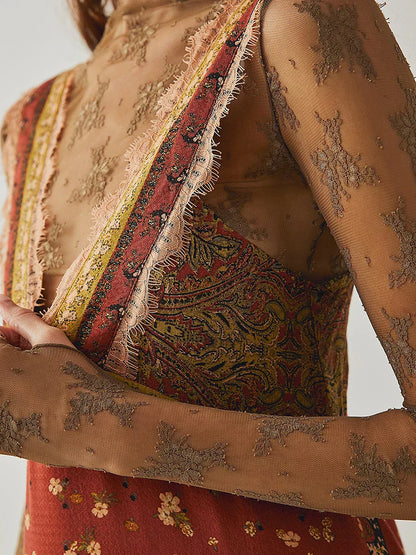 Mint - A woman wearing a sage green bohemian mini slip dress featuring a mixed ditsy floral and rust-colored paisley print, detailed with delicate eyelash lace trim along the V-neckline.