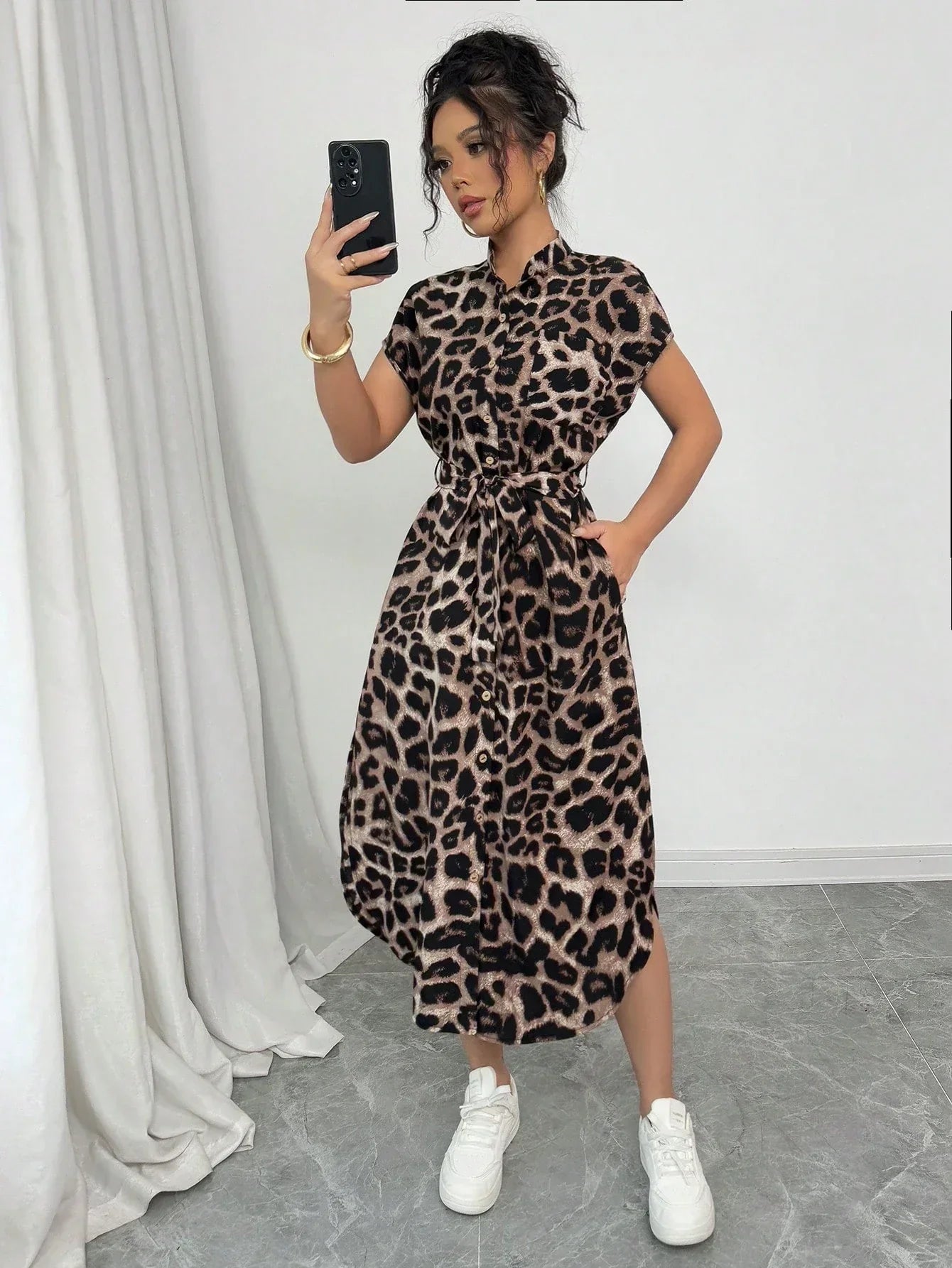 Coffee Brown - Front and back view of a woman wearing a leopard print midi shirt dress with a self-tie belt, button-up front, mandarin collar, and side slits.