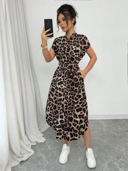 Coffee Brown - Front and back view of a woman wearing a leopard print midi shirt dress with a self-tie belt, button-up front, mandarin collar, and side slits.