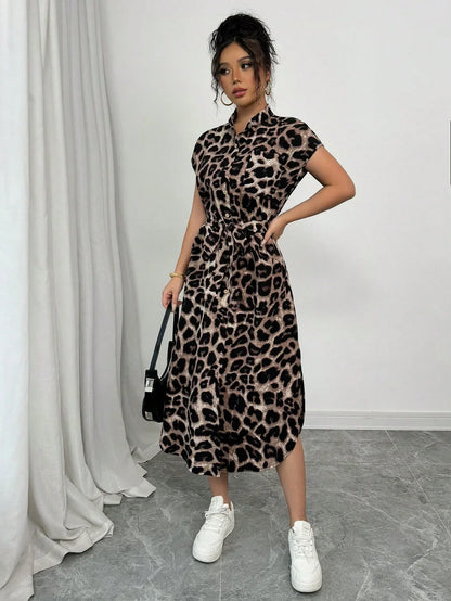 Coffee Brown - Front and back view of a woman wearing a leopard print midi shirt dress with a self-tie belt, button-up front, mandarin collar, and side slits.