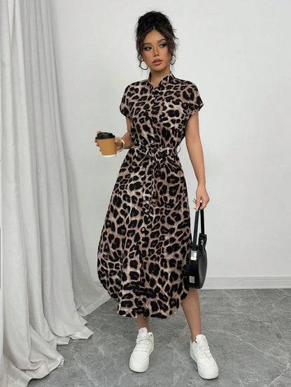 Coffee Brown - Front and back view of a woman wearing a leopard print midi shirt dress with a self-tie belt, button-up front, mandarin collar, and side slits.