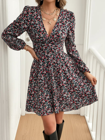 Mixed Colors - Woman wearing a lightweight long sleeve mini dress featuring an abstract leopard print, a v-neckline, and a prominent ruched waist.