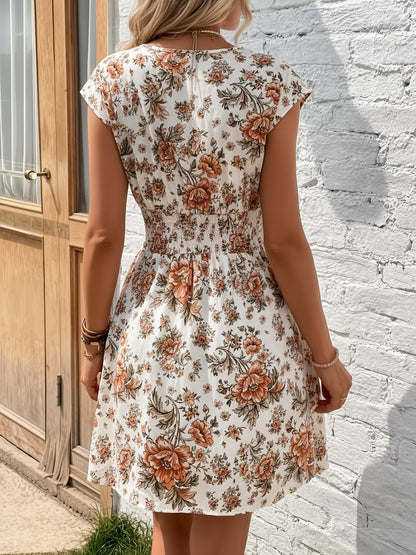 Orange - Woman wearing a lightweight chiffon mini dress with a leopard print, cap sleeves, and a smocked waist