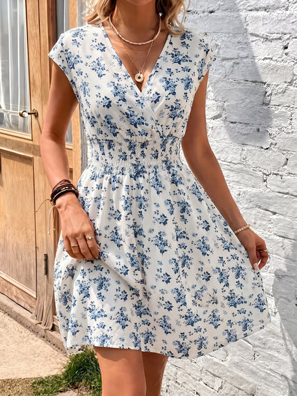 Blue - Woman wearing a lightweight chiffon mini dress with a leopard print, cap sleeves, and a smocked waist