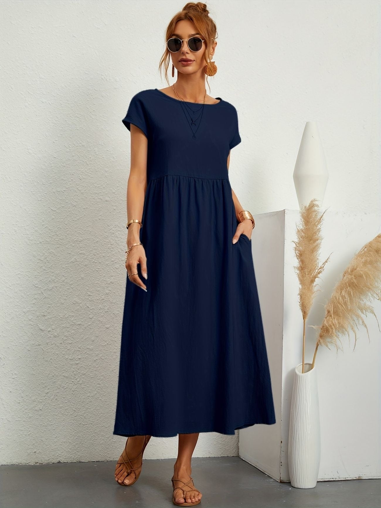 Dark Blue - Dark olive green linen-texture midi dress featuring a round neckline, cap sleeves, gathered empire waist, and side seam pockets.