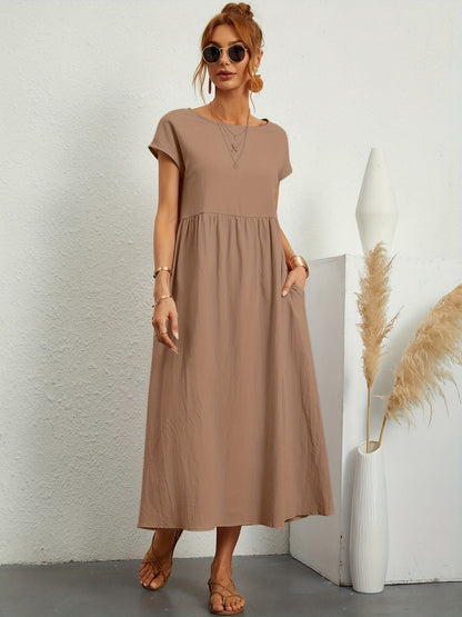 Khaki - Dark olive green linen-texture midi dress featuring a round neckline, cap sleeves, gathered empire waist, and side seam pockets.