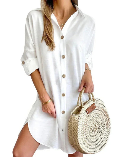 White - White linen button-front mini shirt dress featuring a collared neckline, rolled tab sleeves, and a curved hem with side button details.