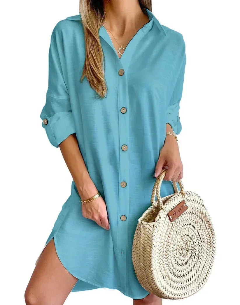 Blue green - White linen button-front mini shirt dress featuring a collared neckline, rolled tab sleeves, and a curved hem with side button details.