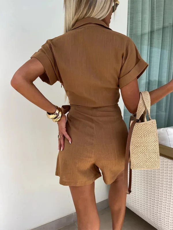 Brown - Woman wearing a rust-colored linen-blend mini dress with a collar, deep V-neck, and tie waist, styled with sandals and a straw bag.