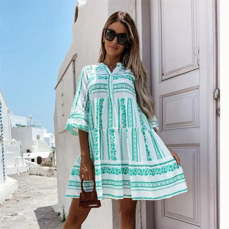 Green - Light blue and white geometric tile print mini dress featuring a split V-neckline, three-quarter flared sleeves, and a voluminous tiered skirt.