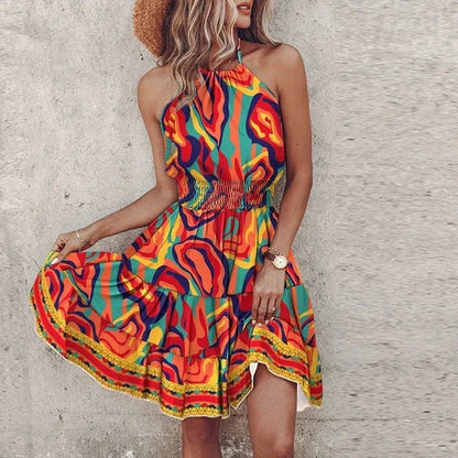 Orange - Women's medallion print mini dress featuring a halter neckline, wide smocked waist, and a fluid tiered skirt.