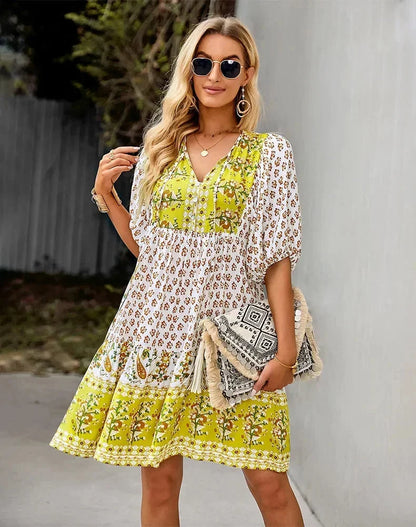 Yellow - Light blue and mustard orange mixed floral print dress featuring a split v-neckline with ties, half puff sleeves, and a tiered skirt.