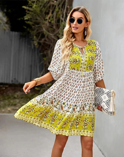 Yellow - Light blue and mustard orange mixed floral print dress featuring a split v-neckline with ties, half puff sleeves, and a tiered skirt.