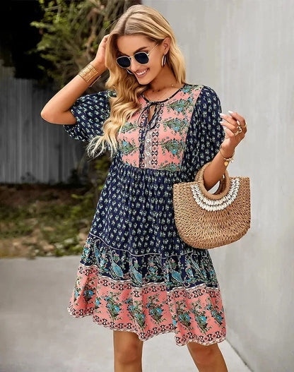 Navy blue - Light blue and mustard orange mixed floral print dress featuring a split v-neckline with ties, half puff sleeves, and a tiered skirt.