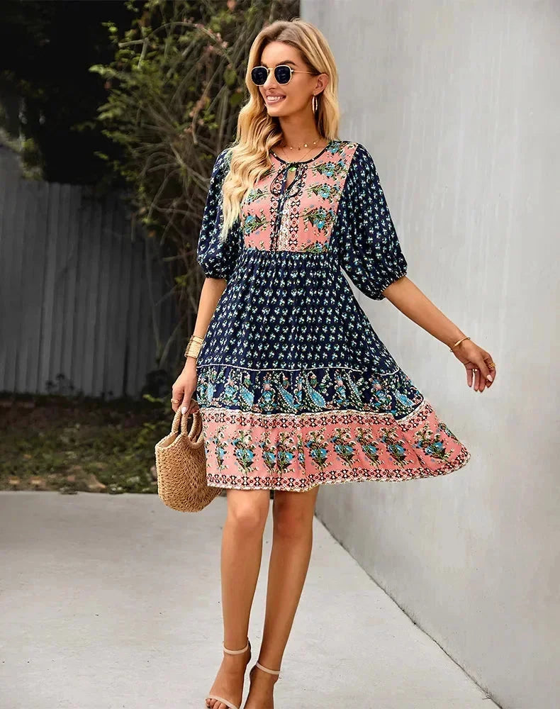 Navy blue - Light blue and mustard orange mixed floral print dress featuring a split v-neckline with ties, half puff sleeves, and a tiered skirt.