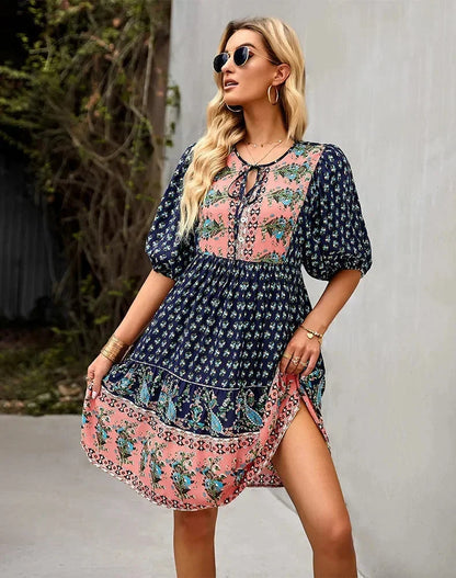 Navy blue - Light blue and mustard orange mixed floral print dress featuring a split v-neckline with ties, half puff sleeves, and a tiered skirt.