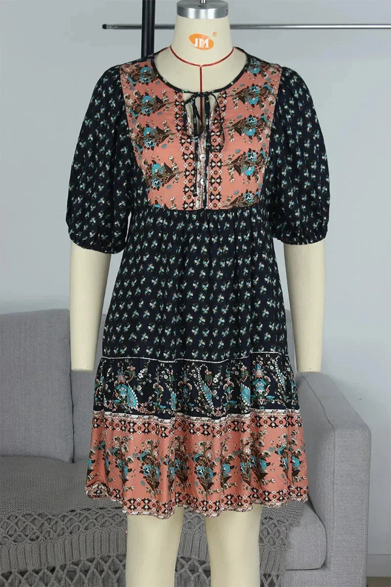 Navy blue - Light blue and mustard orange mixed floral print dress featuring a split v-neckline with ties, half puff sleeves, and a tiered skirt.