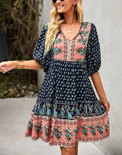 Navy blue - Light blue and mustard orange mixed floral print dress featuring a split v-neckline with ties, half puff sleeves, and a tiered skirt.