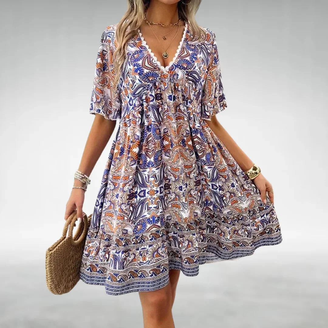 Blue - Women's green and yellow intricate paisley print mini dress featuring a lace-trimmed V-neckline, flutter sleeves, and a tiered ruffled hem.
