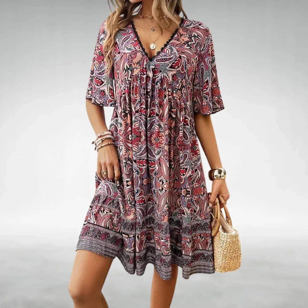 Red - Women's green and yellow intricate paisley print mini dress featuring a lace-trimmed V-neckline, flutter sleeves, and a tiered ruffled hem.