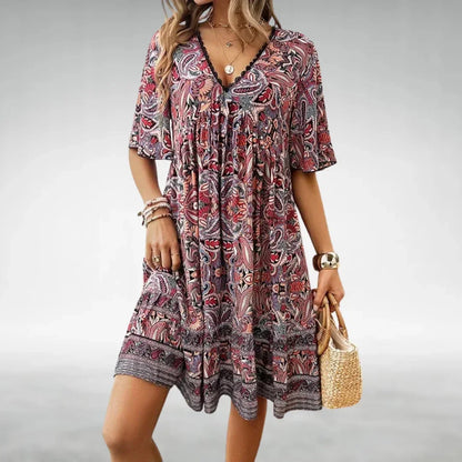 Red - Women's green and yellow intricate paisley print mini dress featuring a lace-trimmed V-neckline, flutter sleeves, and a tiered ruffled hem.