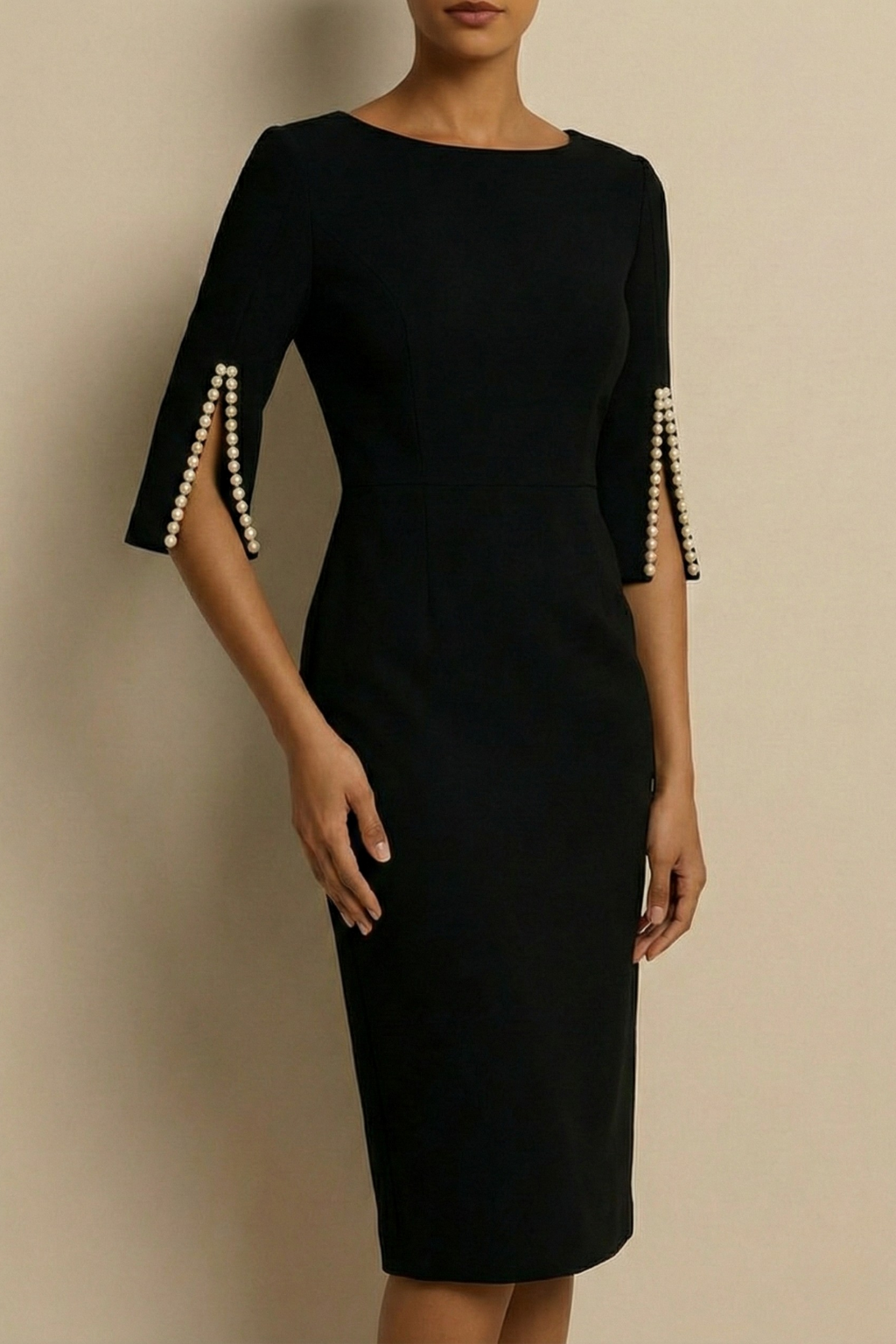 Black - Black crepe sheath dress featuring a bateau neckline and three-quarter split sleeves detailed with pearl embellishments.