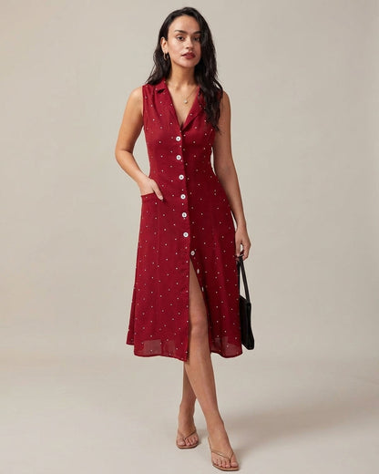 Red - A woman wearing a sleeveless dark red midi dress with white pin dots, featuring a notched collar, button-down front, and side pockets.