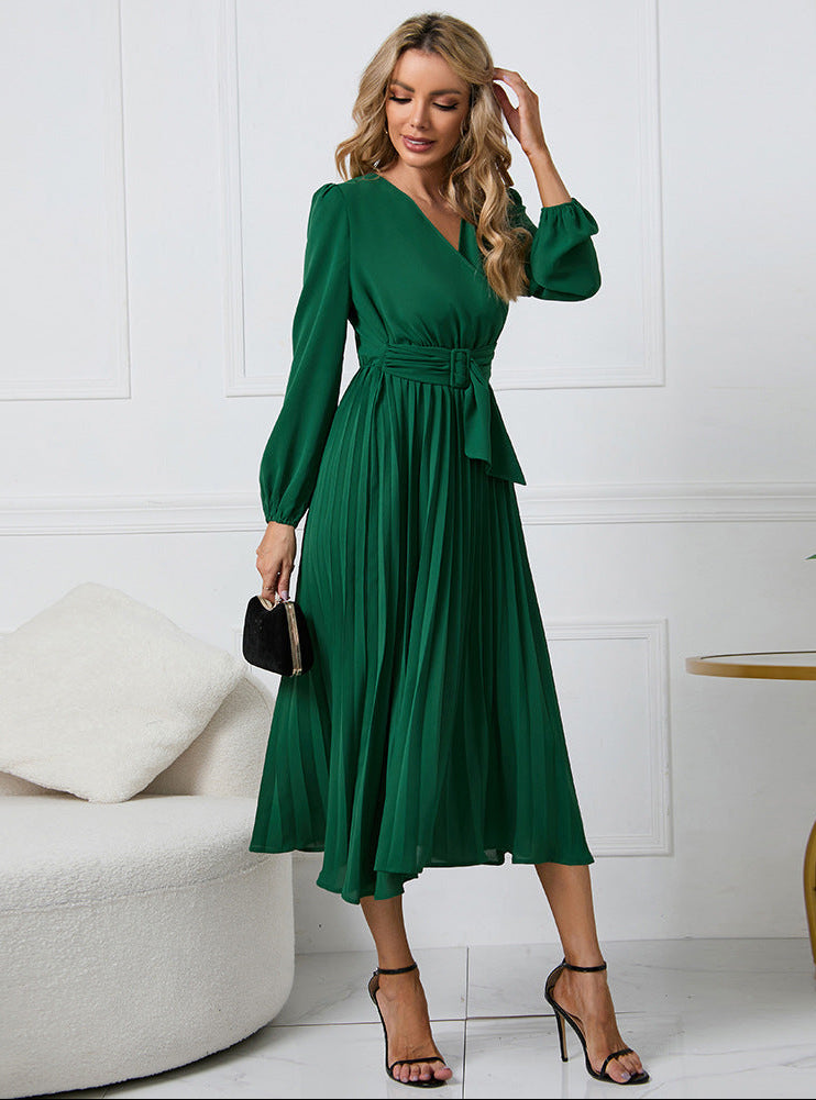 Green - Emerald green long-sleeve midi dress featuring a v-neckline, wide buckled waist belt, and an accordion pleated skirt.