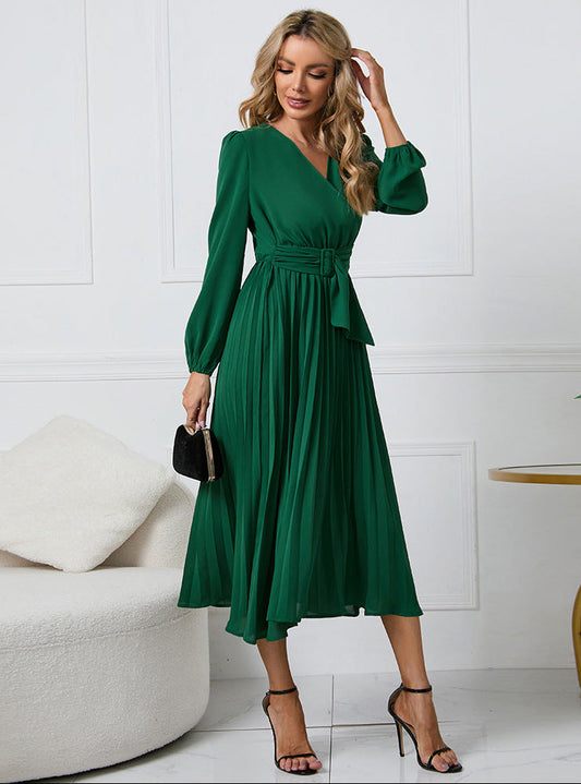Green - Emerald green long-sleeve midi dress featuring a v-neckline, wide buckled waist belt, and an accordion pleated skirt.