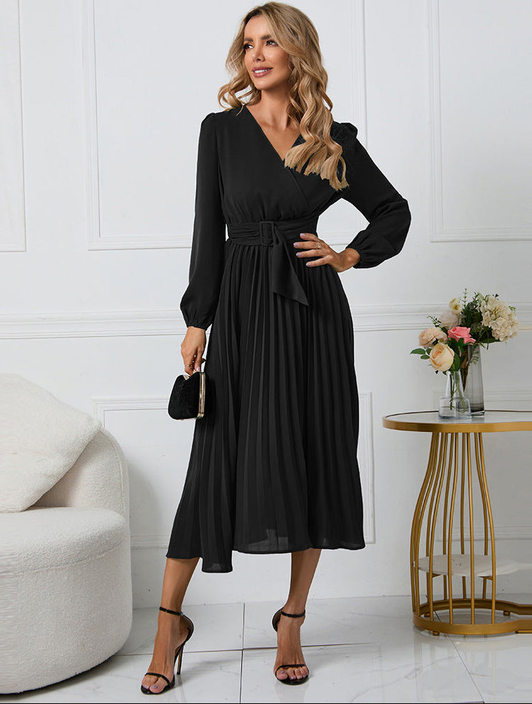 Black - Emerald green long-sleeve midi dress featuring a v-neckline, wide buckled waist belt, and an accordion pleated skirt.