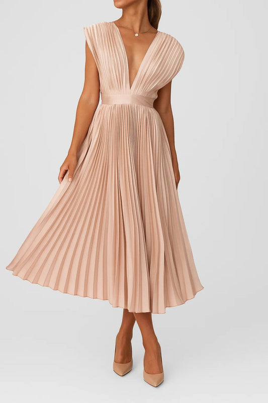 Champagne - Blush pink pleated midi dress featuring a plunging V-neckline, structured banded waist, and a flowing accordion-pleated A-line skirt.