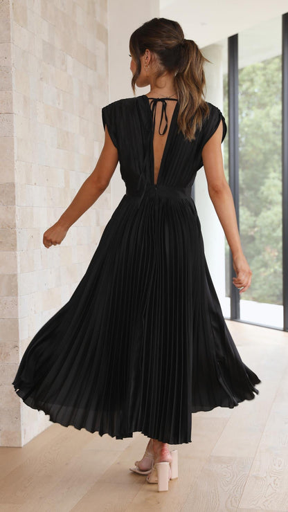 Black - Woman wearing a dusty rose pleated midi dress with a deep V-neckline and banded waist.