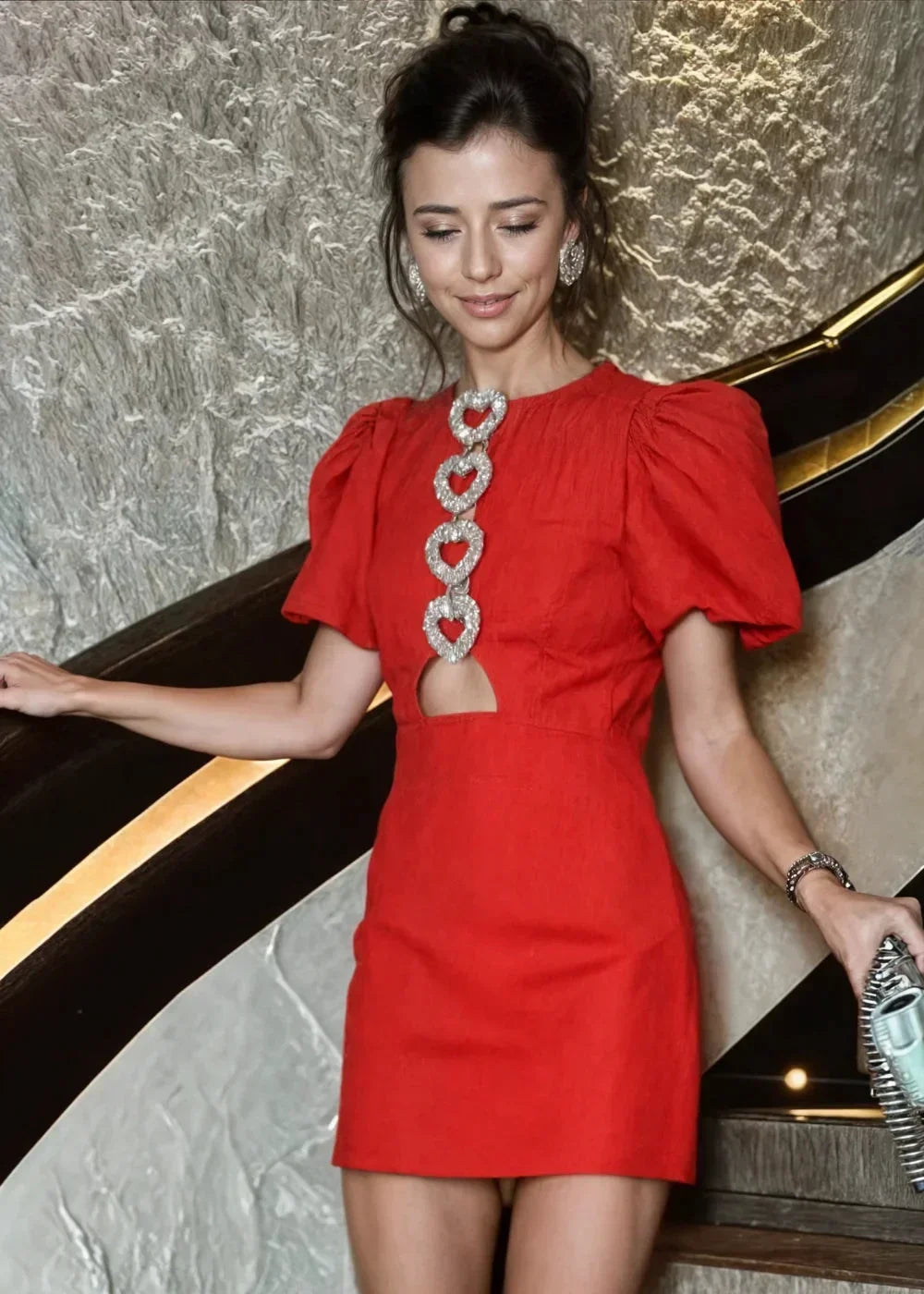 Red - Black mini dress with white polka dots, featuring short puff sleeves, a center front cutout, and three contrasting white 3D bows down the bodice.