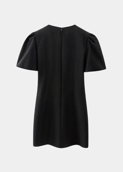 Black with pearls - Black mini dress with white polka dots, featuring short puff sleeves, a center front cutout, and three contrasting white 3D bows down the bodice.
