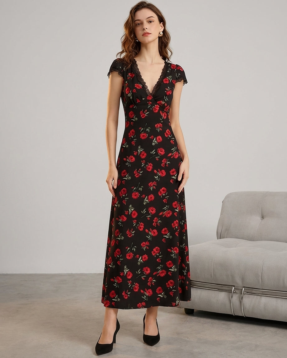 Black - A woman wearing a black midi-length dress with a red rose print, featuring a lace-trimmed V-neckline, cap sleeves, and a fluid A-line skirt.