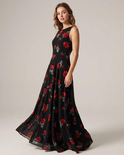 Black - A woman wearing a black midi-length dress with a red rose print, featuring a lace-trimmed V-neckline, cap sleeves, and a fluid A-line skirt.