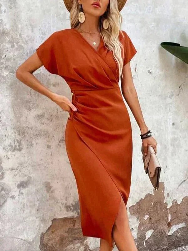 Orange - Woman wearing a burnt orange midi dress with a wrap v-neckline, side ruching, and an asymmetrical front slit.