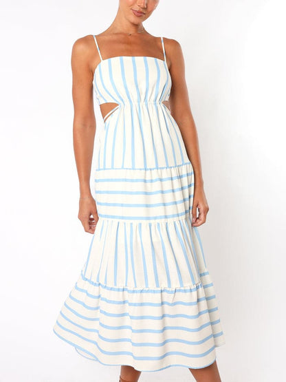Blue Stripe - A woman wearing a light blue and white striped midi dress featuring a square neckline, thin spaghetti straps, side waist cutouts, and a tiered skirt with alternating stripe directions.