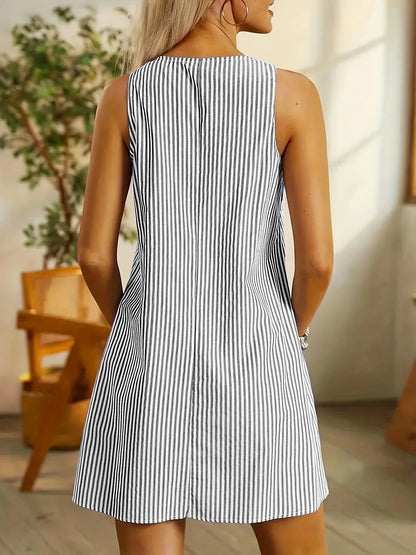 Black - Sleeveless mini shift dress featuring a vertical stripe pattern, scoop neckline, button details on the shoulder straps, and two large front patch pockets.