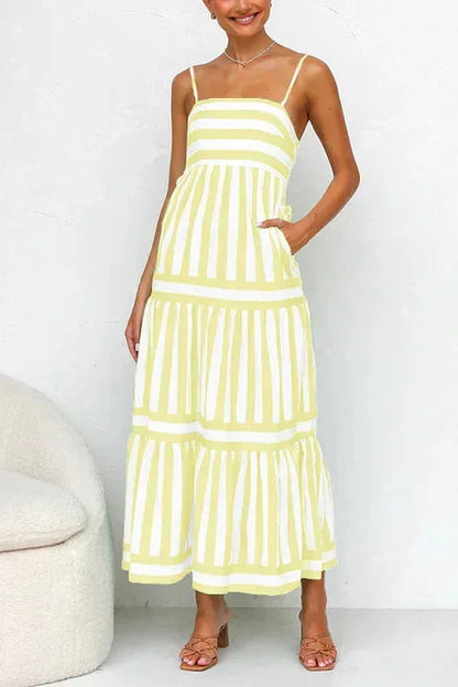Women's striped midi dress featuring a square neckline, thin straps, side pockets, and a tiered skirt with contrasting horizontal and vertical stripe placement.