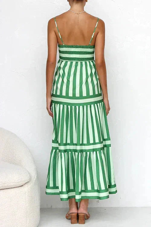 Blue - Women's striped midi dress featuring a square neckline, thin straps, side pockets, and a tiered skirt with contrasting horizontal and vertical stripe placement.