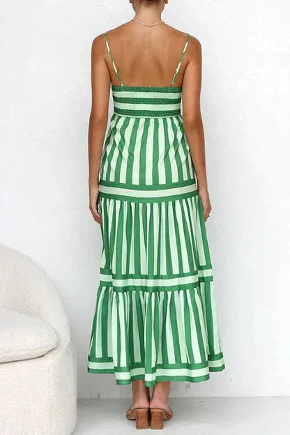 Blue - Women's striped midi dress featuring a square neckline, thin straps, side pockets, and a tiered skirt with contrasting horizontal and vertical stripe placement.