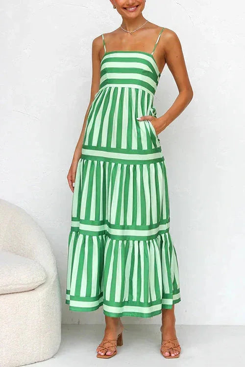 Green - Women's striped midi dress featuring a square neckline, thin straps, side pockets, and a tiered skirt with contrasting horizontal and vertical stripe placement.