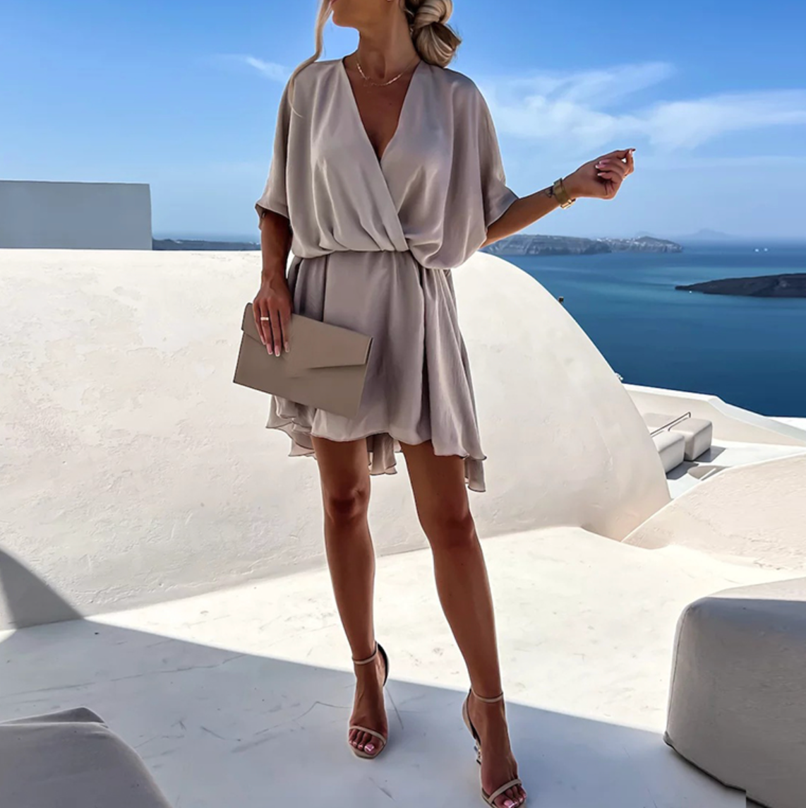 Gray - Emerald green crepe mini dress featuring a draped surplice V-neckline, relaxed dolman sleeves, and a gathered A-line skirt.