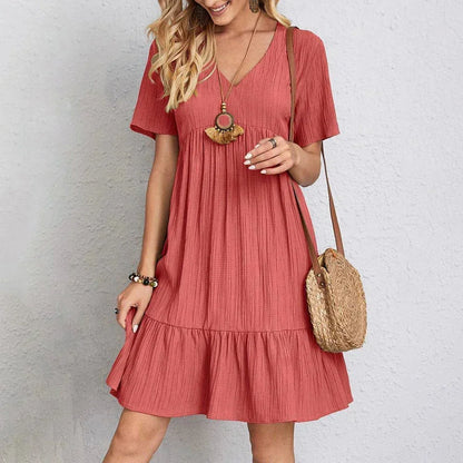 Red - Light green textured crepe mini dress featuring a V-neckline, short sleeves, and a tiered babydoll silhouette.