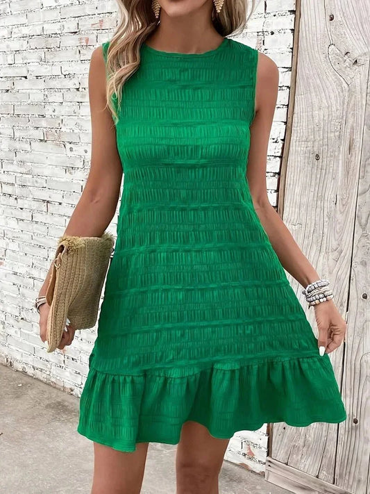 Sleeveless shift mini dress featuring allover horizontal texturing, a high neckline, and a dropped flounce hem.