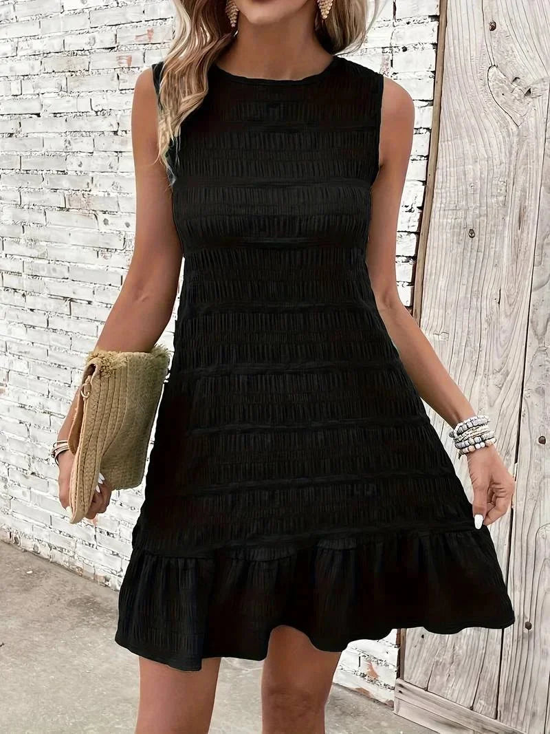 Black - Sleeveless shift mini dress featuring allover horizontal texturing, a high neckline, and a dropped flounce hem.