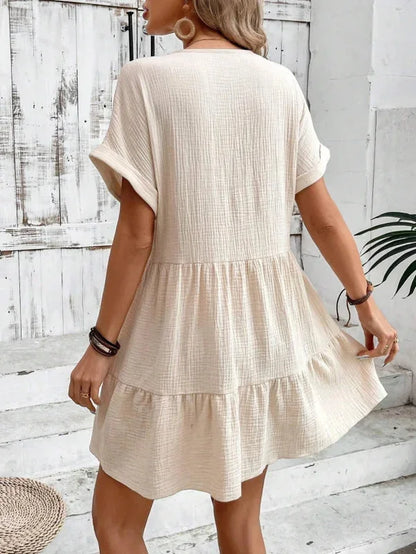 Khaki - Light beige textured linen mini dress featuring a V-neckline, cuffed short sleeves, and a tiered ruffled hem.