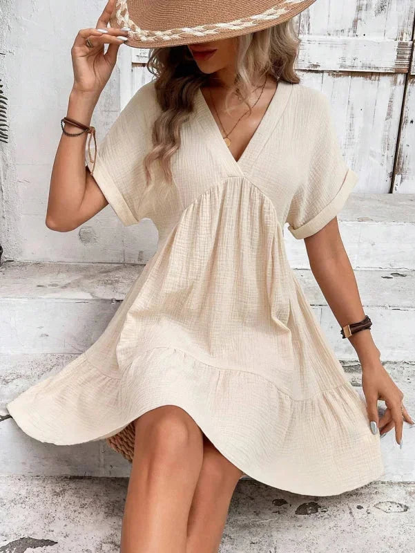 Khaki - Light beige textured linen mini dress featuring a V-neckline, cuffed short sleeves, and a tiered ruffled hem.