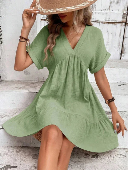 Green - Light beige textured linen mini dress featuring a V-neckline, cuffed short sleeves, and a tiered ruffled hem.